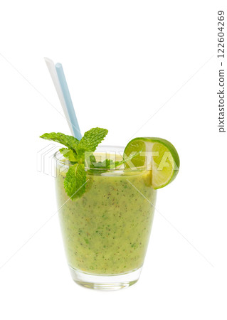 Glass of green healthy shake of lime, kiwi, mint and apple with straw isolated at white background. Concept of vegan superfood and healthy lifestyle. 122604269