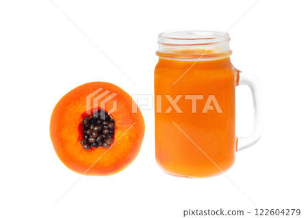 Closeup jar of orange papaya juice and a half of papaya fruit isolated at white background. 122604279