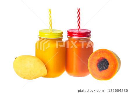 Two jars with tropical fruits juice and whole mango and papaya raw fruits isolated at white background. Dieting, healthy lifestyle and detox. 122604286