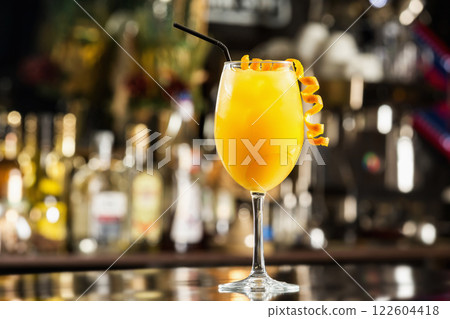Closeup glass of fresh screwdriver cocktail at bar background. Closeup glass of fresh screwdriver cocktail at bar background. 122604418