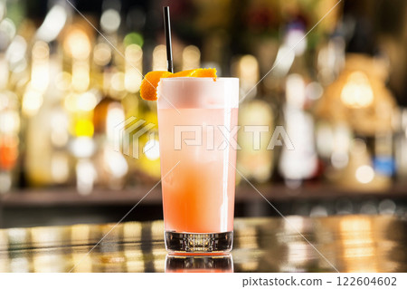 Closeup glass of fresh grapefruit juice at bar counter. 122604602