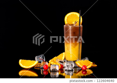 Closeup glass of fresh orange juice mixed with coffee at black isolated background. Closeup glass of fresh orange juice mixed with coffee at black isolated background. 122604640