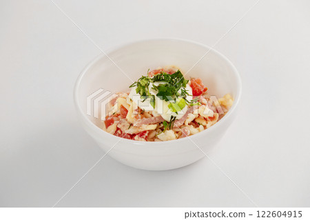 Bowl of salad with tomato, cheese and beef isolated at white background. 122604915