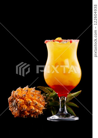 Closeup glass of mai tai cocktail decorated with pineapple isolated at black background. 122604938