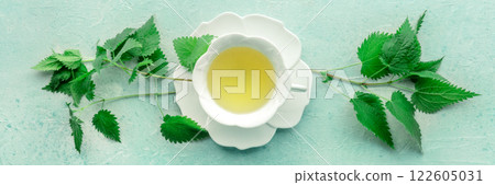 Nettle tea. Medicinal herbal tea with Urtica leaves. Fresh wild herb 122605031