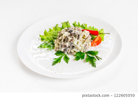 Plate of salad with beef and mushrooms decorated with vegetables isolated at white background. 122605050