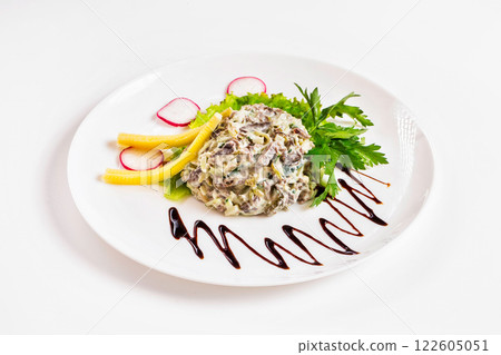 Plate of salad with cheese and beef decorated with mapple syrup isolated at white background. 122605051