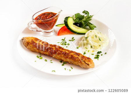 National meal chicken shish kebab with sauce isolated at white background. 122605089