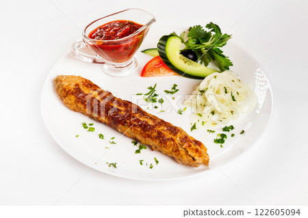 National meal chicken shish kebab with sauce isolated at white background. 122605094