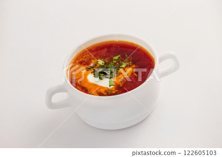 Fresh traditional Ukraine borsh with sour cream in bowl isolated at white background. Fresh traditional Ukraine borsh with sour cream in bowl isolated at white background. 122605103