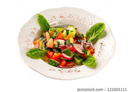 Plate of fresh vegetables vegetarian salad with radish, tomatoes, cucumber and basil isolated at white background. 122605111