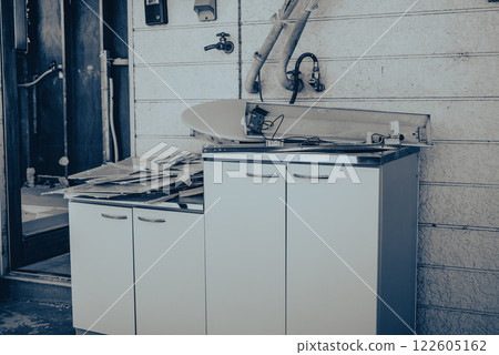 A kitchen removed during the demolition of an apartment building A kitchen removed during the demolition of an apartment building 122605162