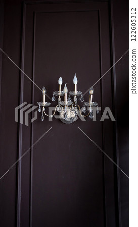 Luxury chandelier on wall 122605312