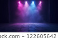 A dark, futuristic space illuminated by vibrant pink and purple lights with hazy fog 122605642