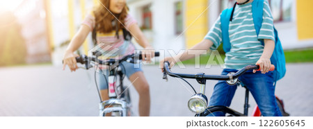 Boy and girl on the bicycles riding together. Boy and girl on the bicycles riding together. 122605645