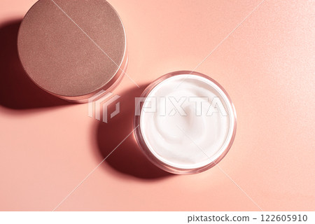 Cosmetic cream jar on pink beige background 122605910