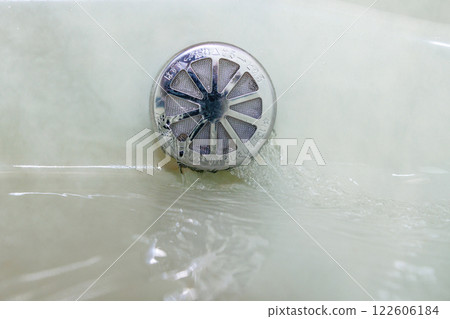 Bathtub filling with hot water water heater 122606184