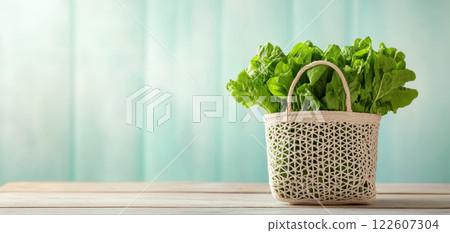 Fresh vegetables in stylish reusable bag on wooden table 122607304
