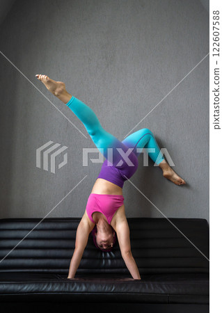 Dynamic Yoga Pose on Couch Embracing Flexibility in Action with Poise and Control 122607588