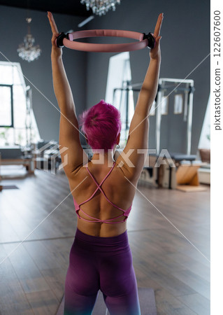 Modern Pilates studio with bright, spacious windows for exercise and wellbeing Modern Pilates studio with bright, spacious windows for exercise and wellbeing 122607600