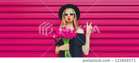 Beautiful stylish woman with bouquet of pink rose flowers blowing kiss on colorful background Beautiful stylish woman with bouquet of pink rose flowers blowing kiss on colorful background 122608571