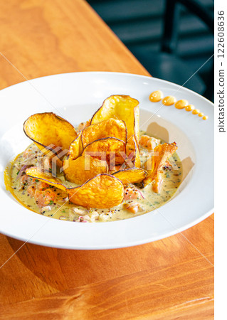 PERUVIAN CEVICHE SEBICHE. Peruvian seafood and fish sebiche with maize and potato sweet crips 122608636