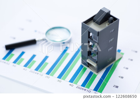 Company performance graph, corporate building and magnifying glass 122608650