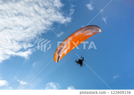 Paraglider flying and cloud. Parachute. Paraglider flying and cloud. Parachute. 122609136