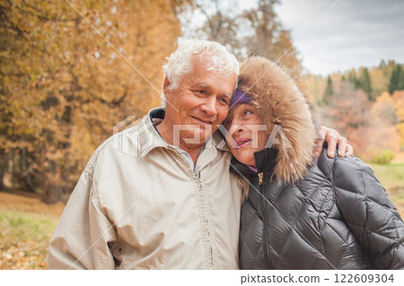 Senior Husband and Wife in autumn park Senior Husband and Wife in autumn park 122609304