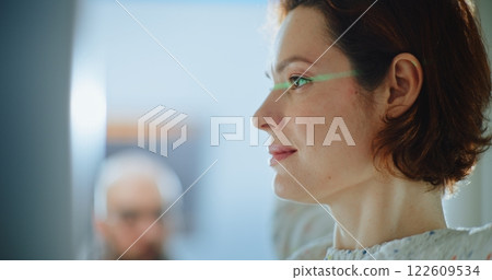 Airport Terminal: Close Up of Passengers Walking Through X-ray Metal Detector Scanner Gates 122609534