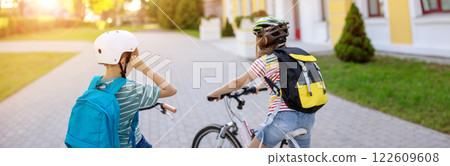 Boy and girl on the bicycles riding together. Boy and girl on the bicycles riding together. 122609608