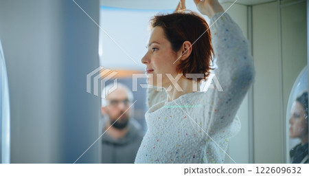 Airport Terminal: Diverse Passengers Passing Through X-ray Metal Detector Scanner Gates Airport Terminal: Diverse Passengers Passing Through X-ray Metal Detector Scanner Gates 122609632