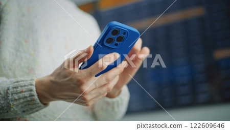 Airport Terminal: Woman Checking Information for Boarding Plane Flight Using Smartphone 122609646