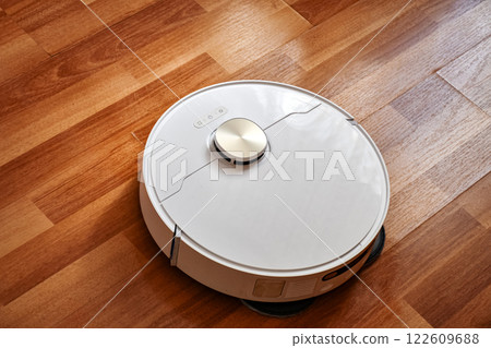 Robot vacuum cleaner cleans the apartment Robot vacuum cleaner cleans the apartment 122609688
