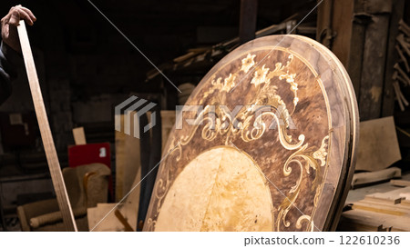 Assembling the kitchen drawer with a tray for the spoons and forks 122610236