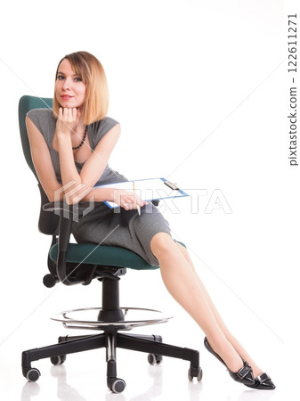 young business woman sitting with her clipboard isolated young business woman sitting with her clipboard isolated 122611271