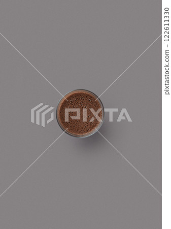 top shot on a gray background glass glass with cocoa children's favorite drink lot of bubbles sweet cocoa beans top shot on a gray background glass glass with cocoa children's favorite drink lot of bubbles sweet cocoa beans 122611330