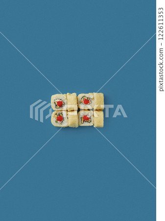 top shot on blue background lies a set of sushi with rice and seafood avocado sushi wrapped in salmon meat red caviar with seaweed professional Japanese cuisine kitchen sushi without shade 122611353