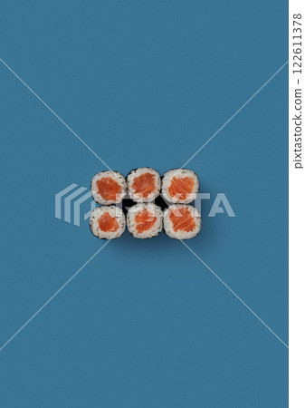 top shot on blue background lies a set of sushi with rice and seafood avocado sushi wrapped in salmon meat red caviar with seaweed professional Japanese cuisine kitchen sushi without shade top shot on blue background lies a set of sushi with rice and seafood avocado sushi wrapped in salmon meat red caviar with seaweed professional Japanese cuisine kitchen sushi without shade 122611378