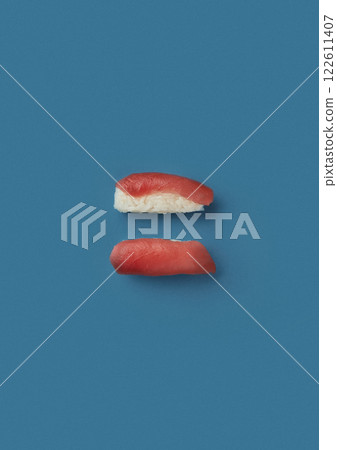 top shot on a blue background lies a set with two sashimi with sea red fish tuna professional serving of Japanese cuisine top shot on a blue background lies freshly caught seafood chef's skill 122611407