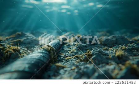 Submarine cable resting on the seabed in soft sunlight 122611488