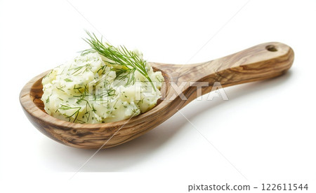 Mashed potatoes with dill in a wooden spoon on a white background 122611544