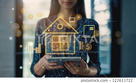 A woman utilizes a tablet to manage her finances, with a focus on homeownership, savings, and potential investment returns 122611722