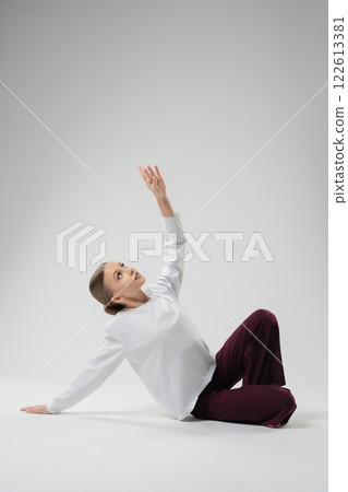 Girl dances expressively in a contemporary arts session 122613381