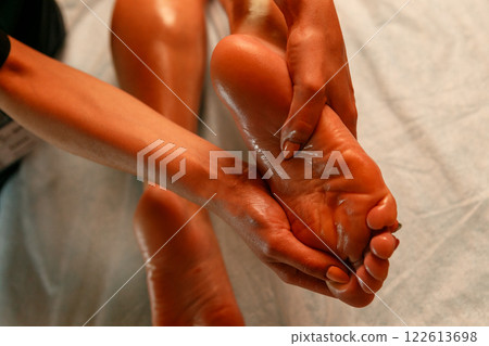 Close-up of feet, woman having leg rehabilitation massage. 122613698