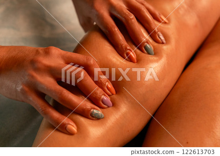 Close-up of feet, woman having leg rehabilitation massage. 122613703