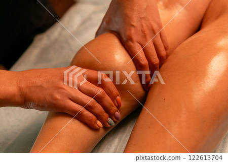 Close-up of feet, woman having leg rehabilitation massage. 122613704