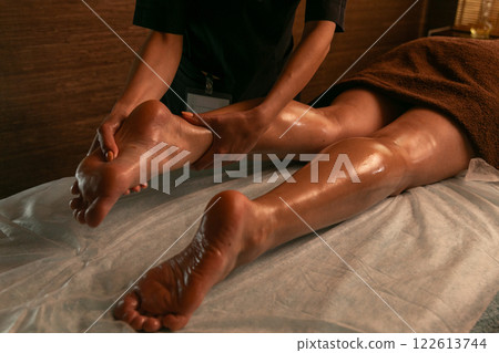 Close-up of feet, woman having leg rehabilitation massage. 122613744