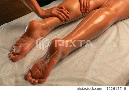 Close-up of feet, woman having leg rehabilitation massage. 122613746