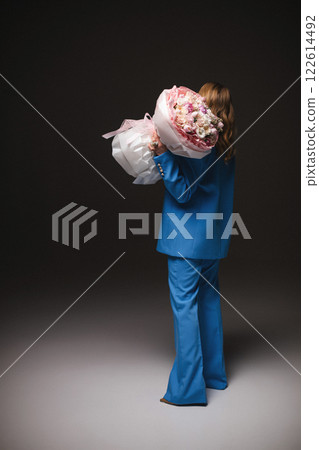 Beautiful stylish woman in a blue suit with 122614492